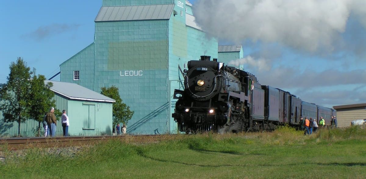 Leduc grain elevator with steam train — historic Alberta landmark