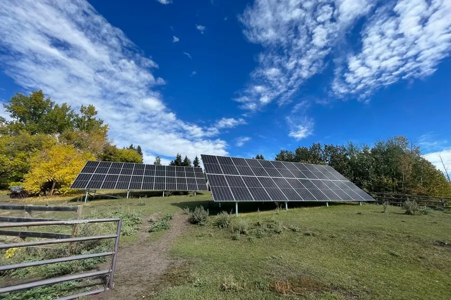 Two-array ground-mount solar system by Stellar Upgrades on rural Alberta farm operated by Patt Gunn