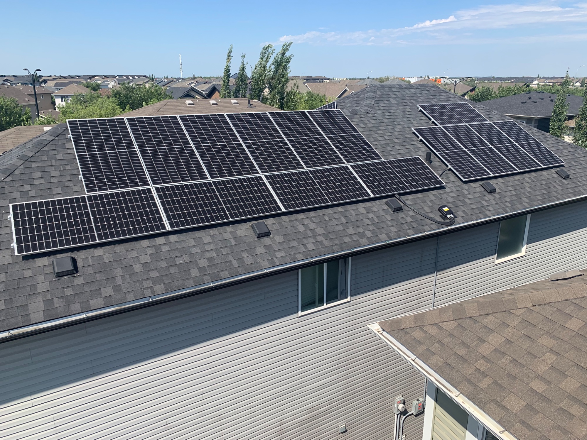 Aerial view of 32-panel rooftop solar installation in Edmonton