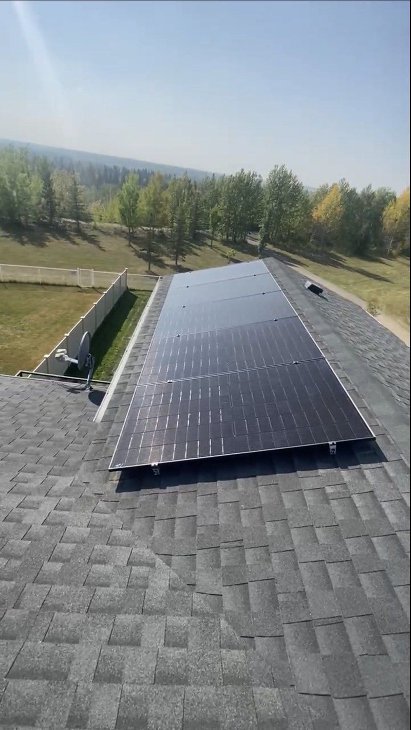 Rooftop solar panel installation on an acreage in summer, Alberta by Stellar Upgrades